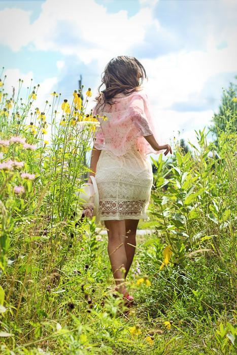 Woman Running on wildflowers Meadow