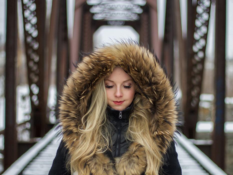 blonde in winter on the bridge