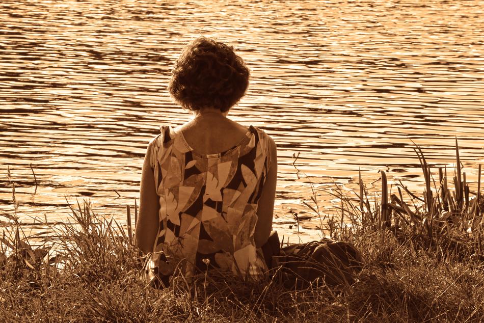 Vintage photo of the woman near the water