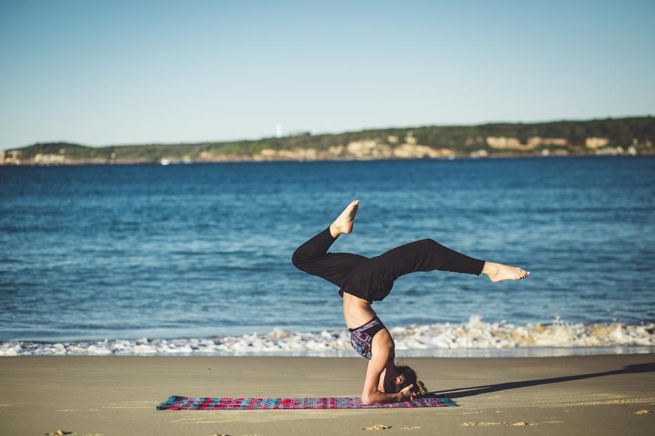 woman meditates by the sea