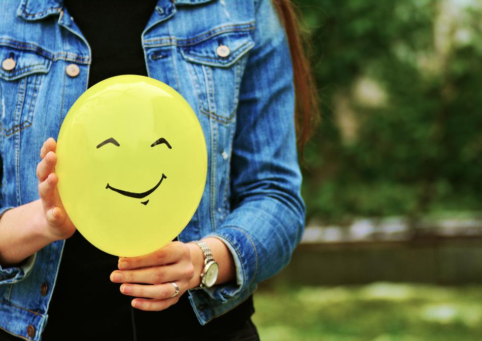 Balloon with smiling face in Hands, Relationship