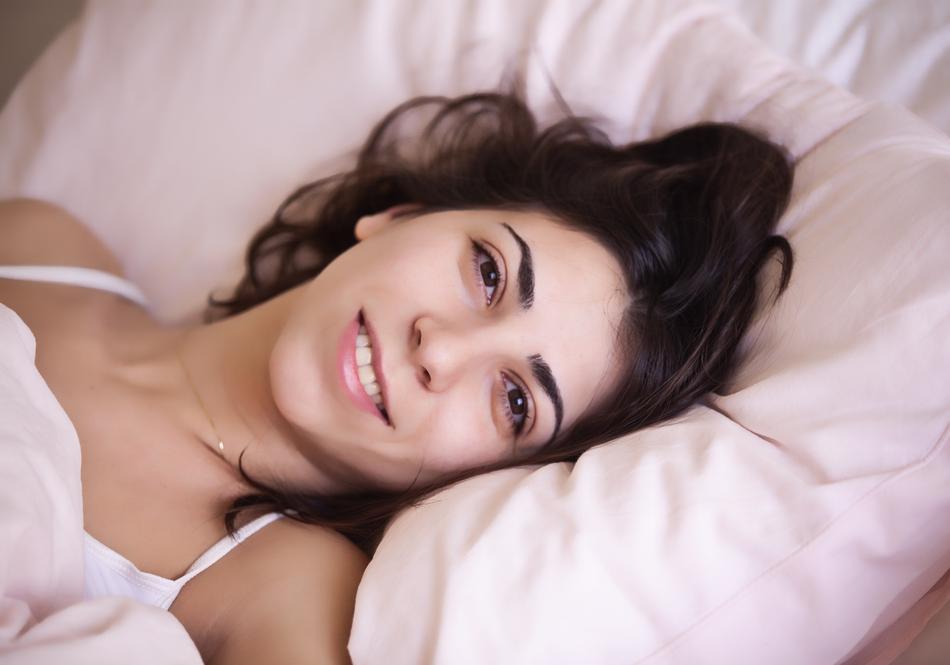 happy beautiful girl head on Pillow, Awakening