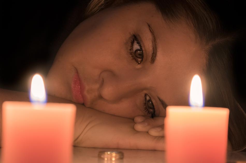 Woman Face anf candles Divorce Sadness