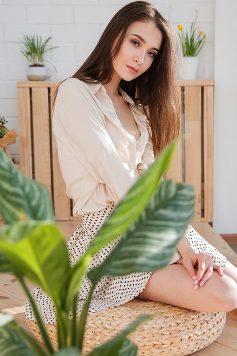 portrait of an attractive woman in beige clothes