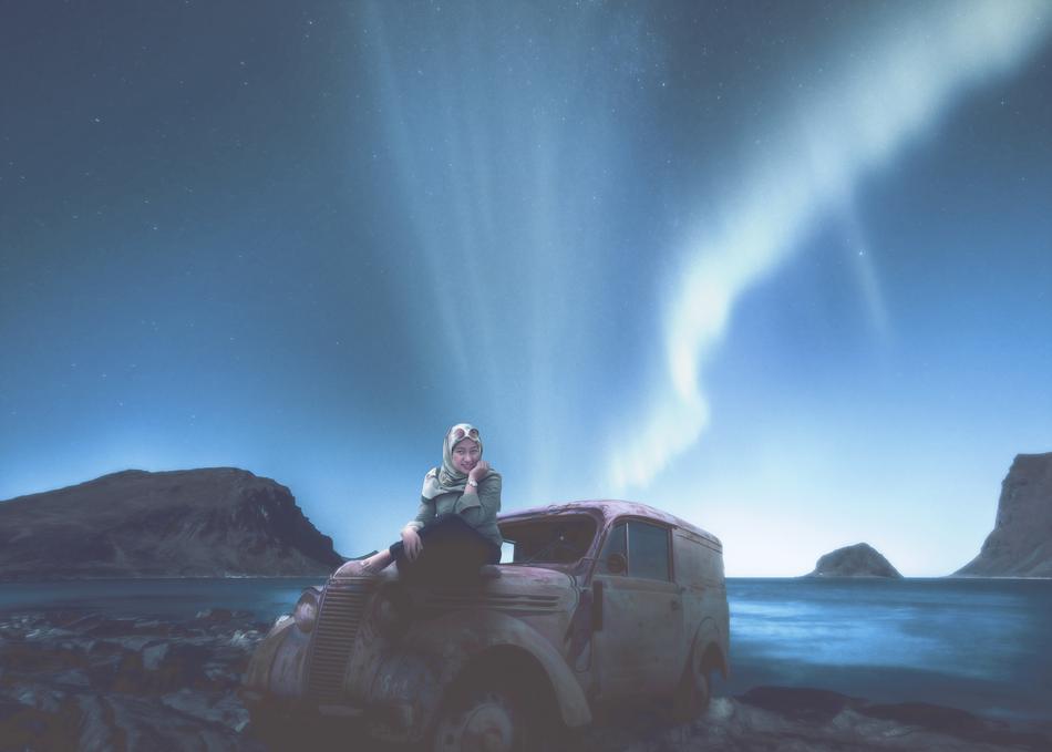 Woman sits on rusty car hood on seaside at dusk, digital art