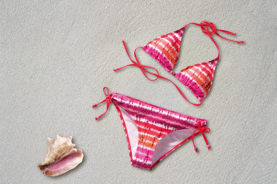 photo of pink bikini and shells