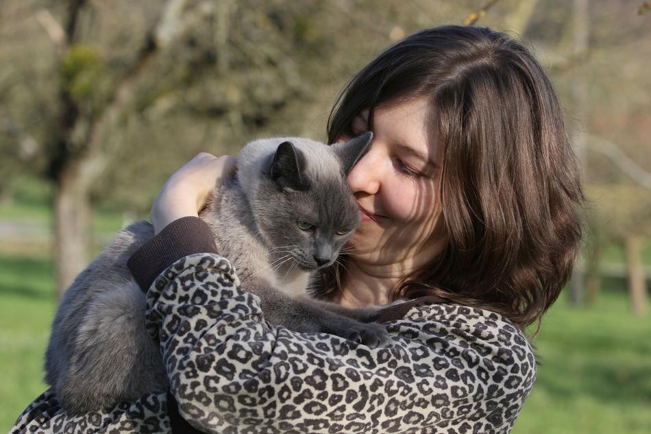 woman with grey cat