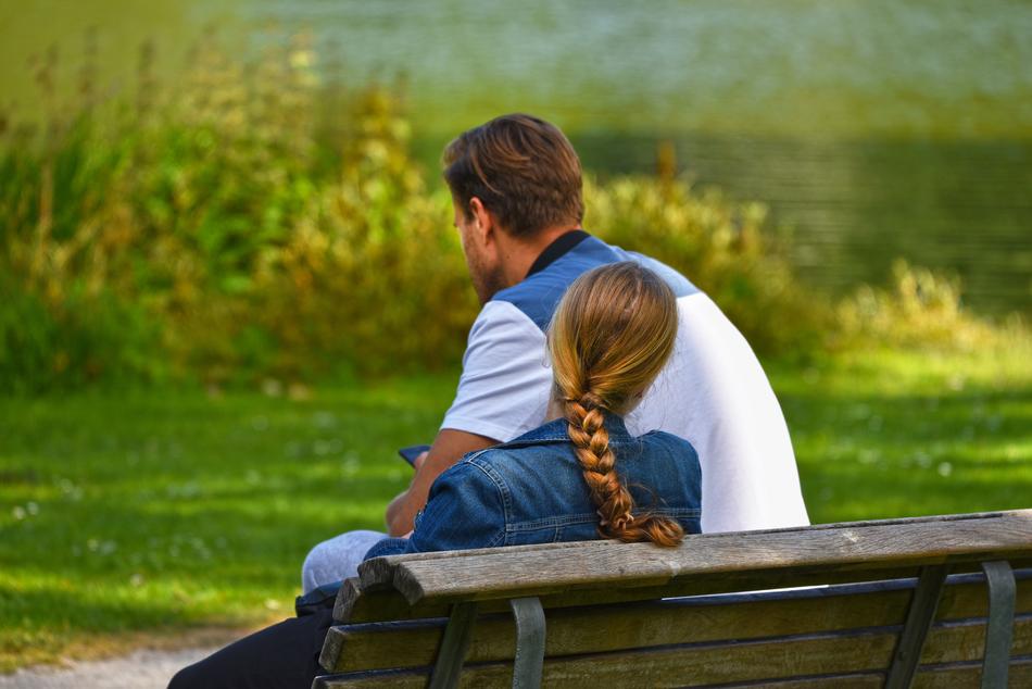 couple on a bench on a sunny evening
