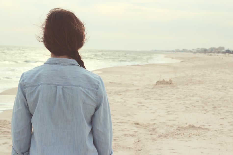 Woman in blue shirt on Beach