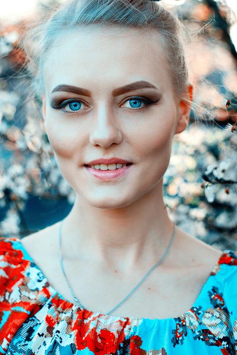 Portrait of young blue eyed woman