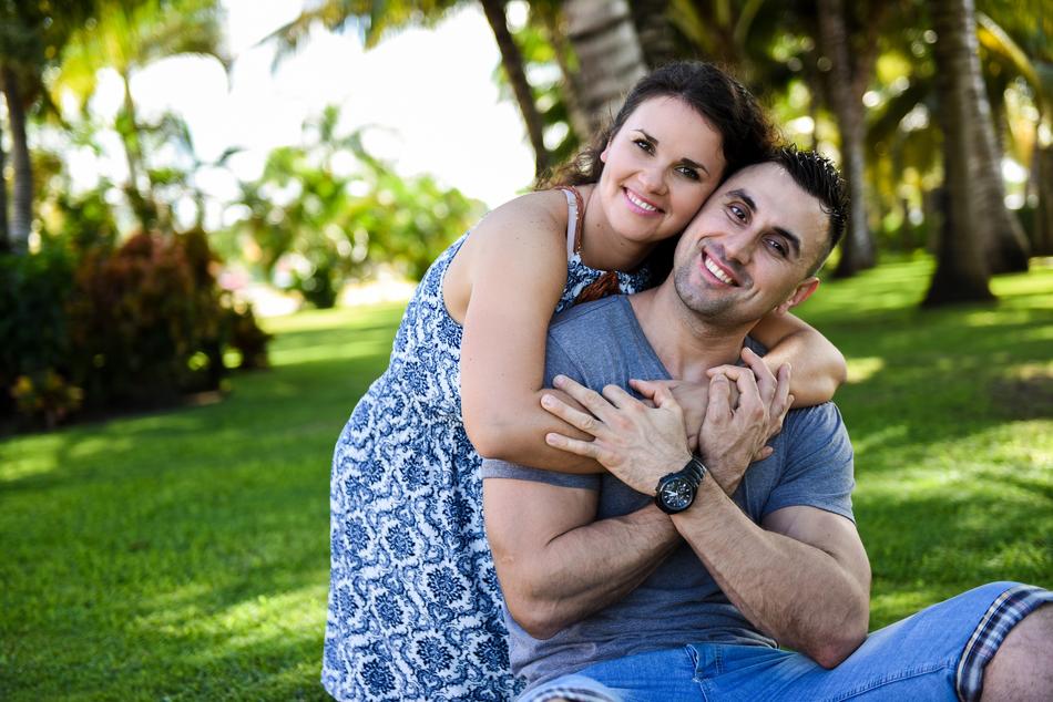adult Couple In Love on lawn at sunny day