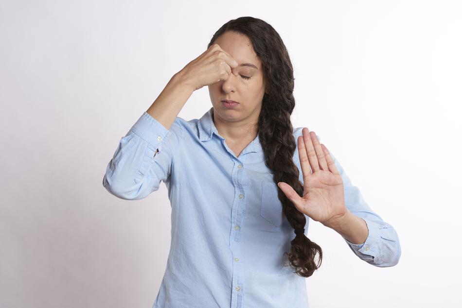 Excited young girl with protective gesture