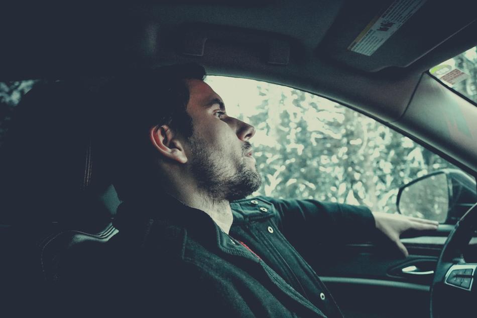 tired man sitting in the car