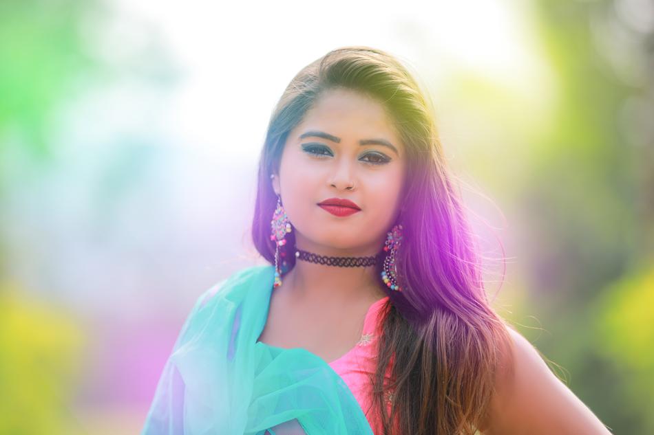 portrait of a girl in bright clothes on a blurred background