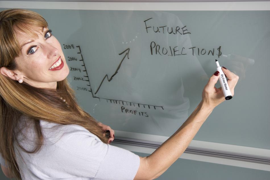 smiling woman manager near whiteboard