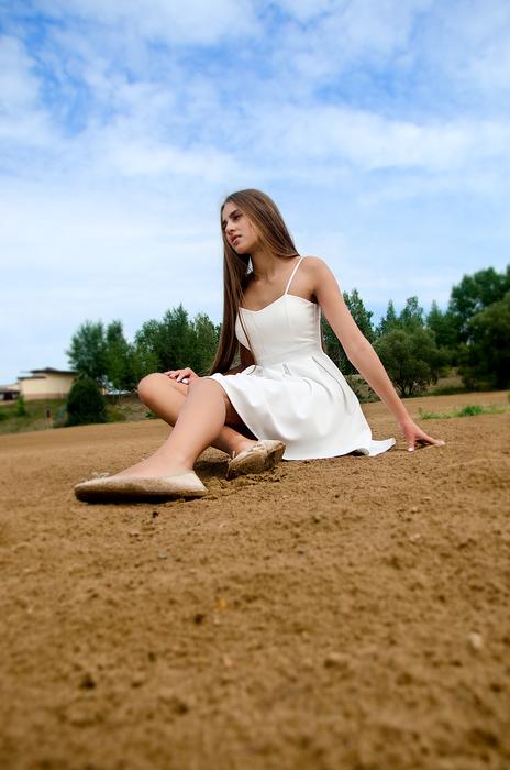 model in white summer dress