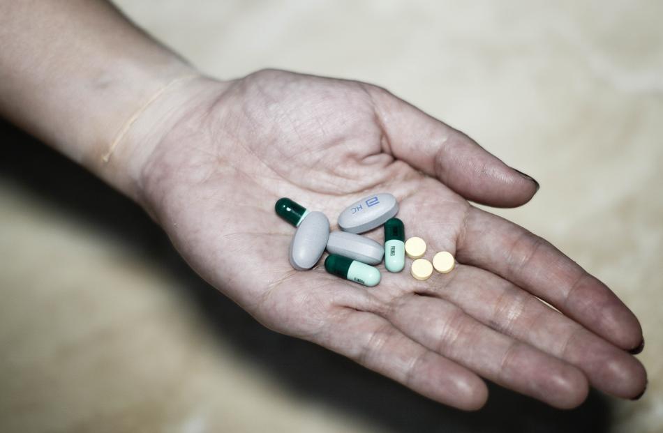 medicines on dirty palm