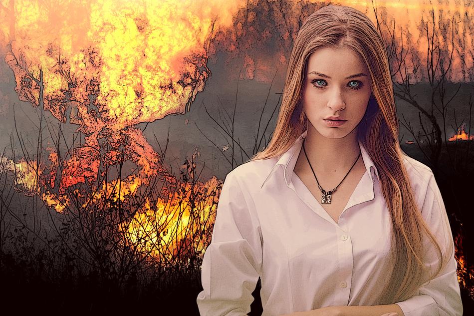 beautiful girl on the background of a forest fire