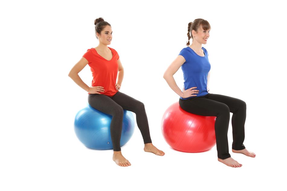picture of two women exercising with fitballs