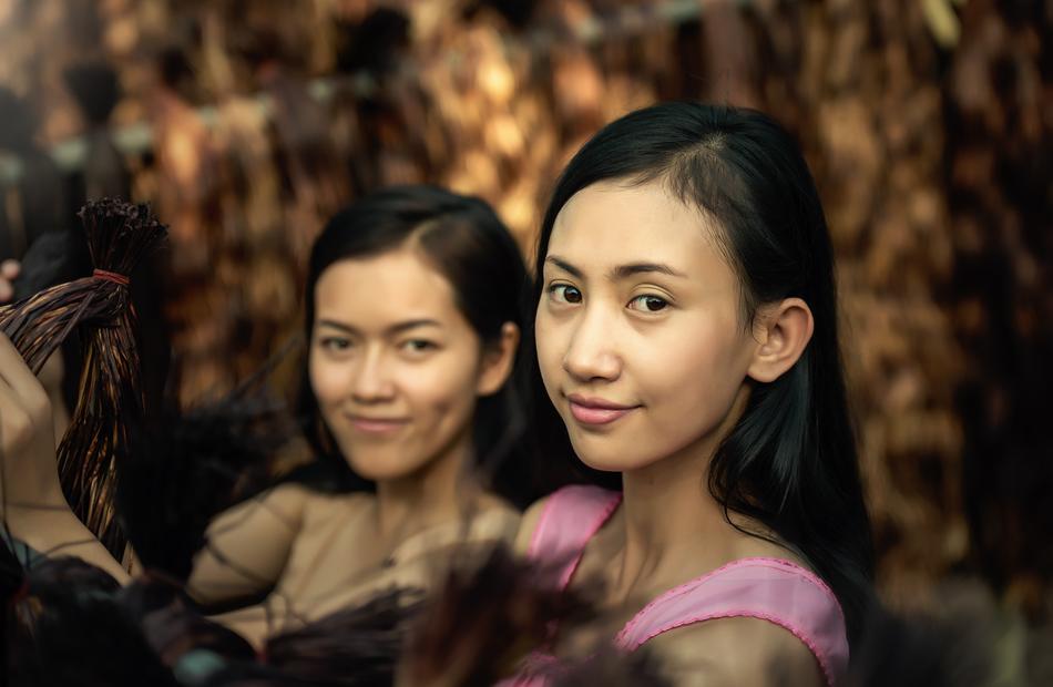 Portrait of the posing, smiling Asian women in Bangkok, Thailand, in autumn