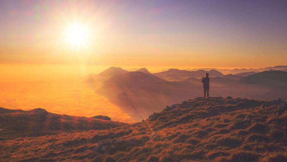 man at sunset in the mountains