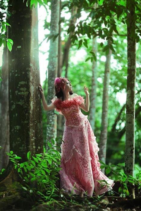 Beautiful Woman in green Forest