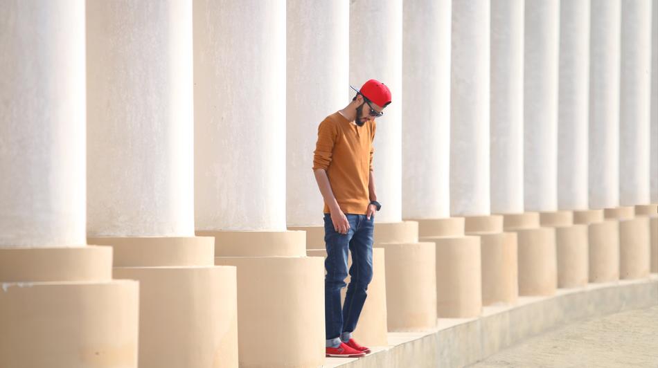 photo of a stylish guy in front of columns in Pakistan