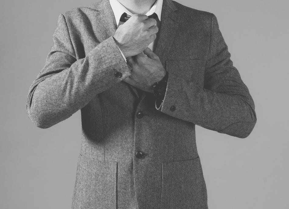 Black and white photo of the man in suit