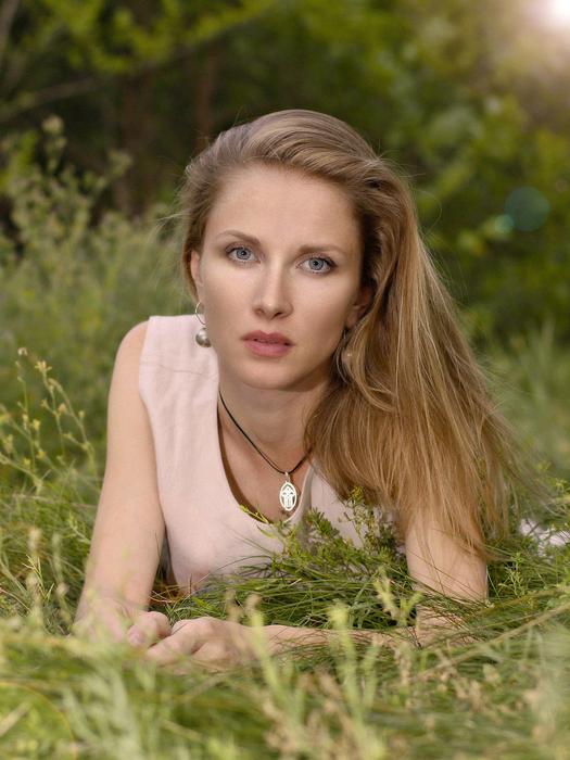 Portrait of blonde Girl on grass