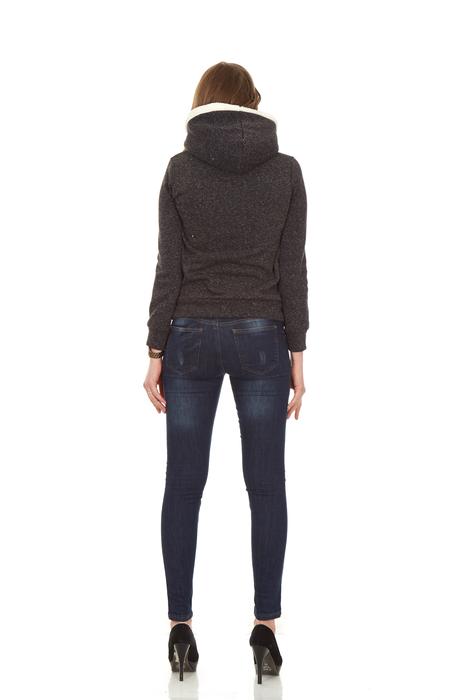 Back view of the woman, in the jacket, at white background