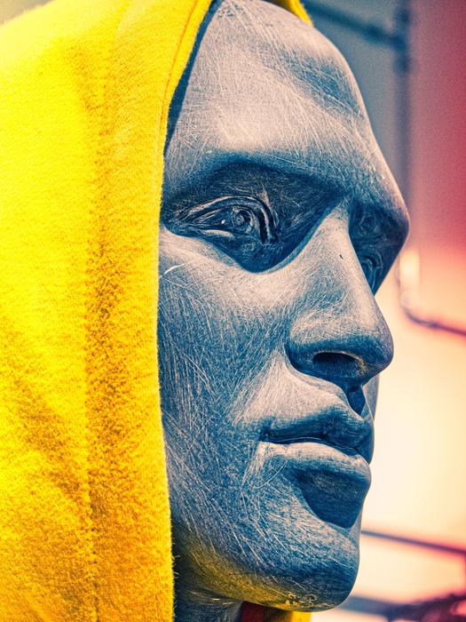 mannequin in yellow hood close up