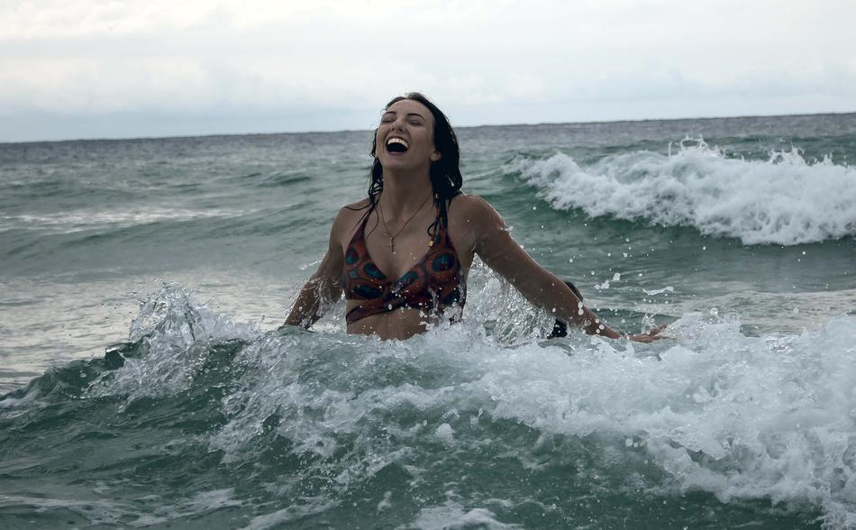 happy woman on ocean
