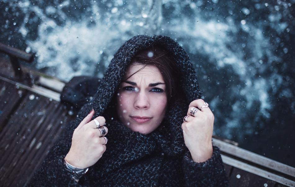 woman in fashionable coat on snow