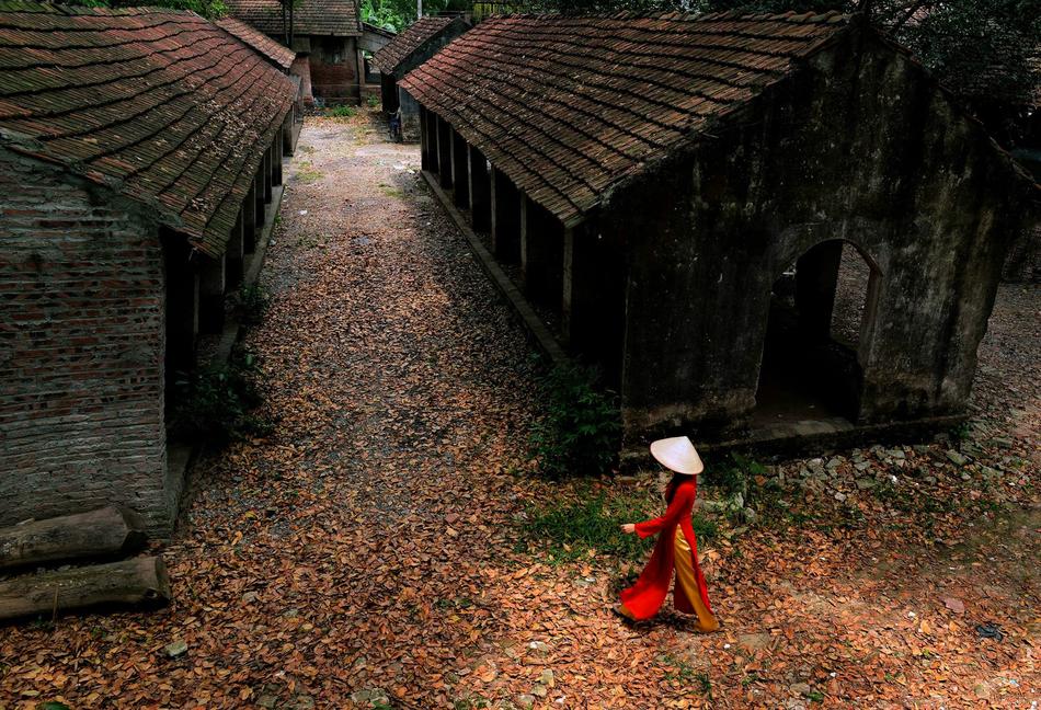person in red robe in abandoned area