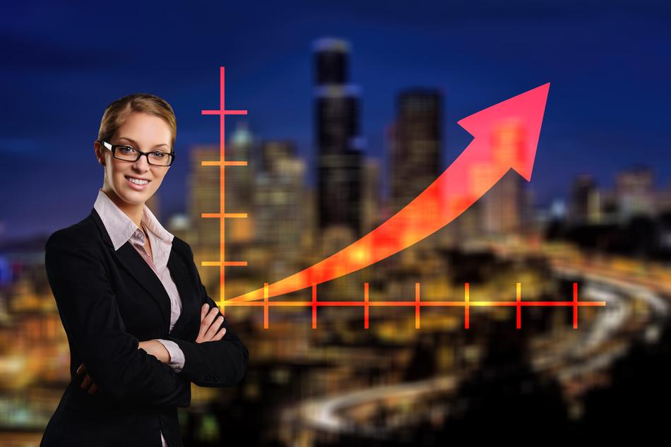 business woman with diagram on city background
