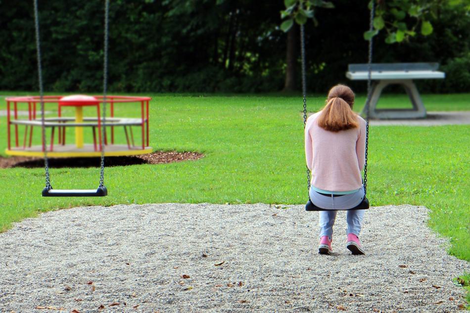 Girl alone playground