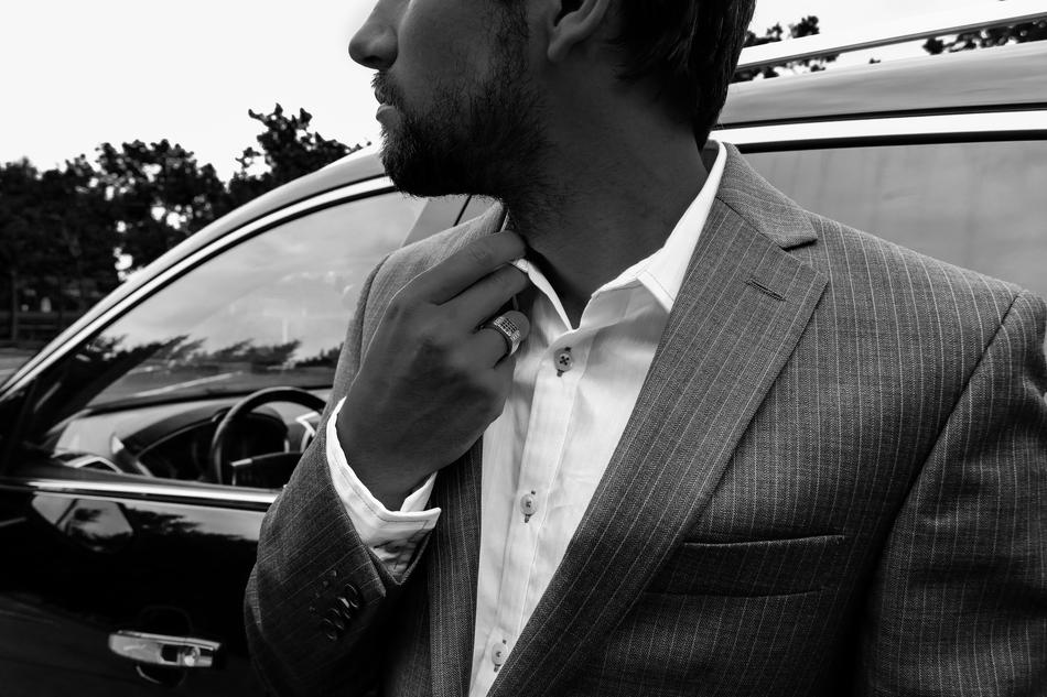 Man in Suit at luxury car