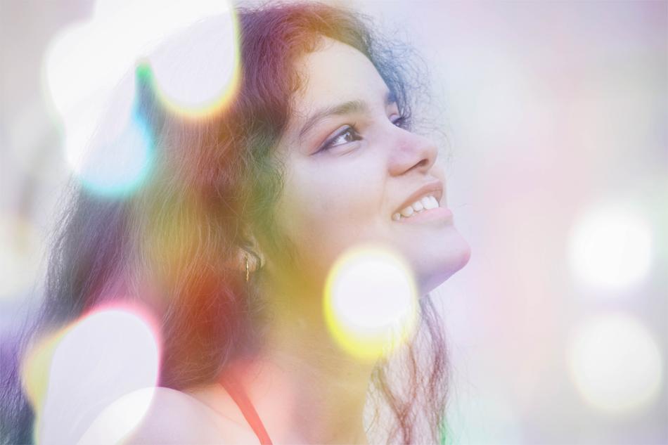 happy woman portrait with bokeh effect