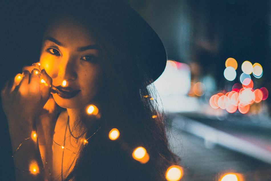 beautiful lady in Christmas lights