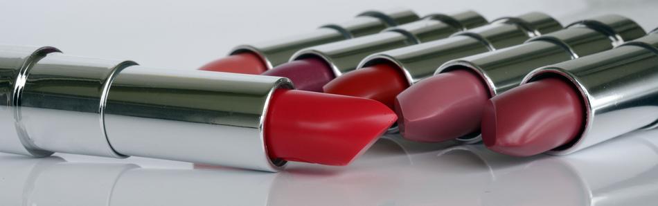 bright lipsticks on a shiny surface