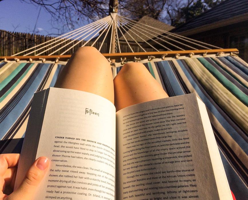 girl Reading book on Hammock