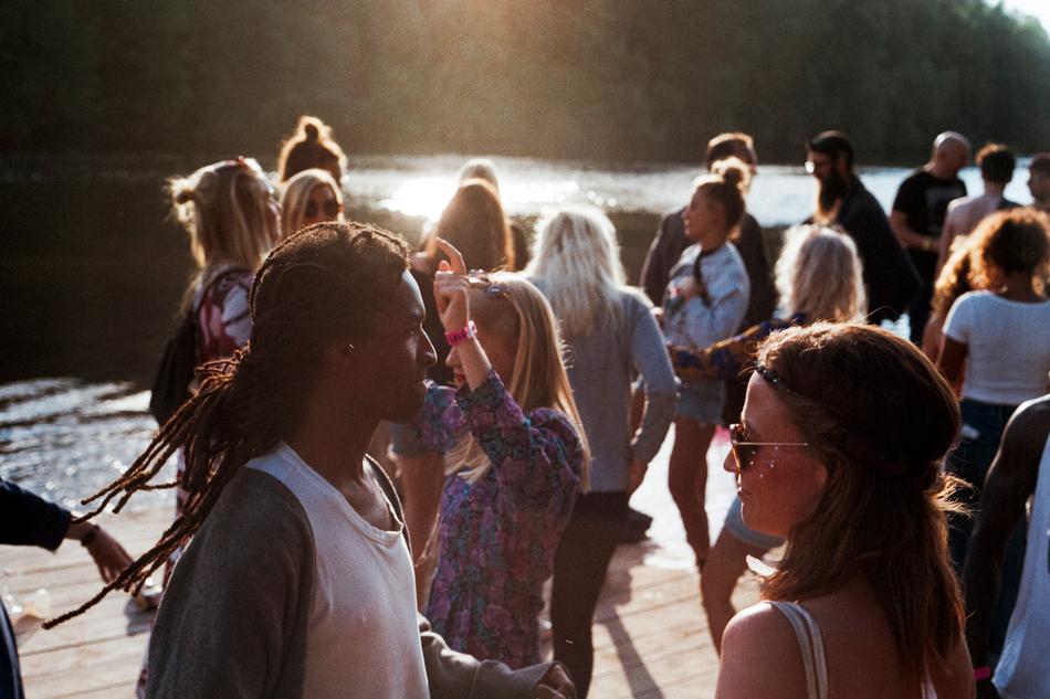 Crowd of people near the beautiful water in light