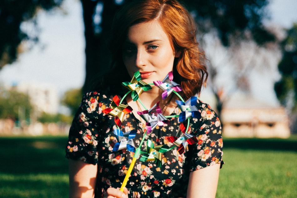 red head woman with pinwheel