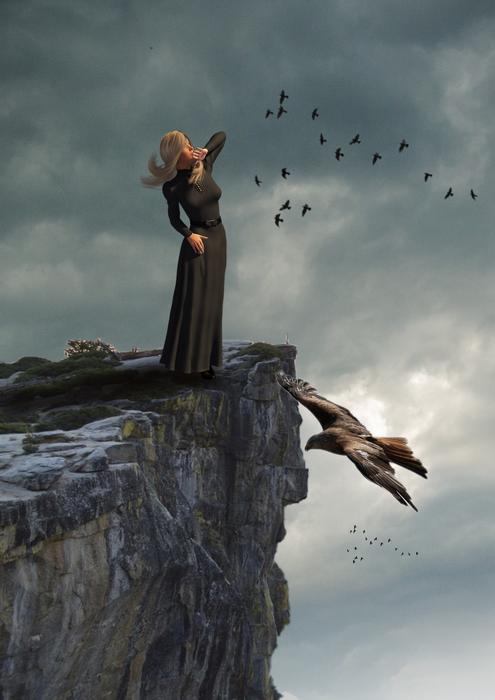 woman in dress on the rock