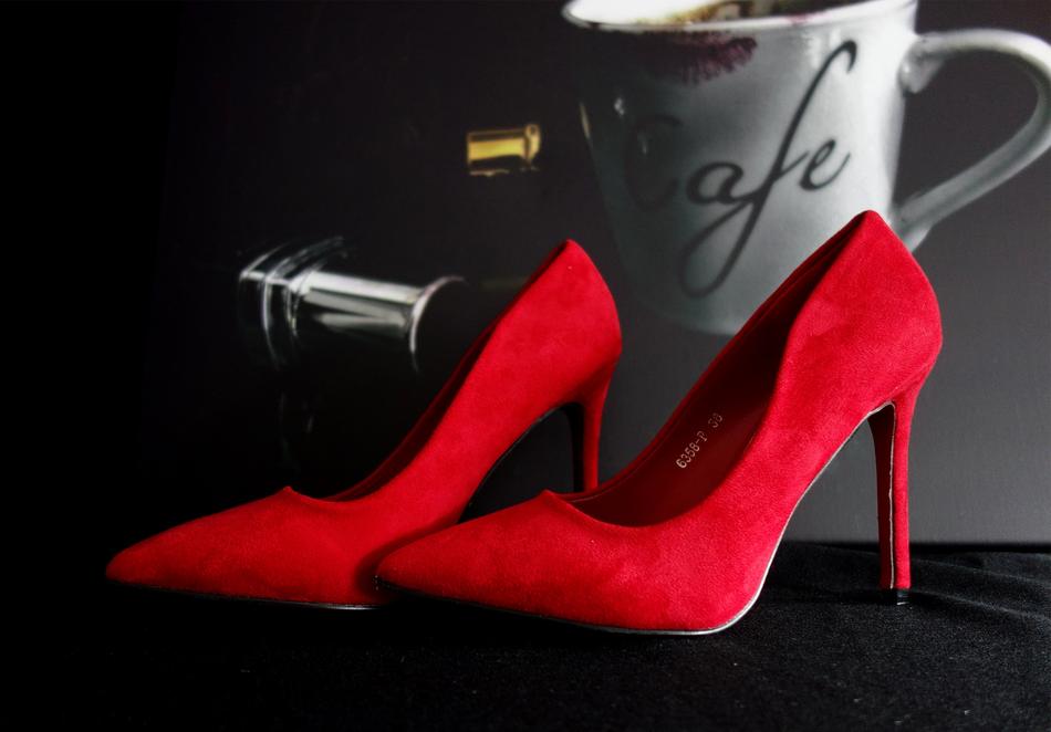 lipstick and espresso near red women's shoes