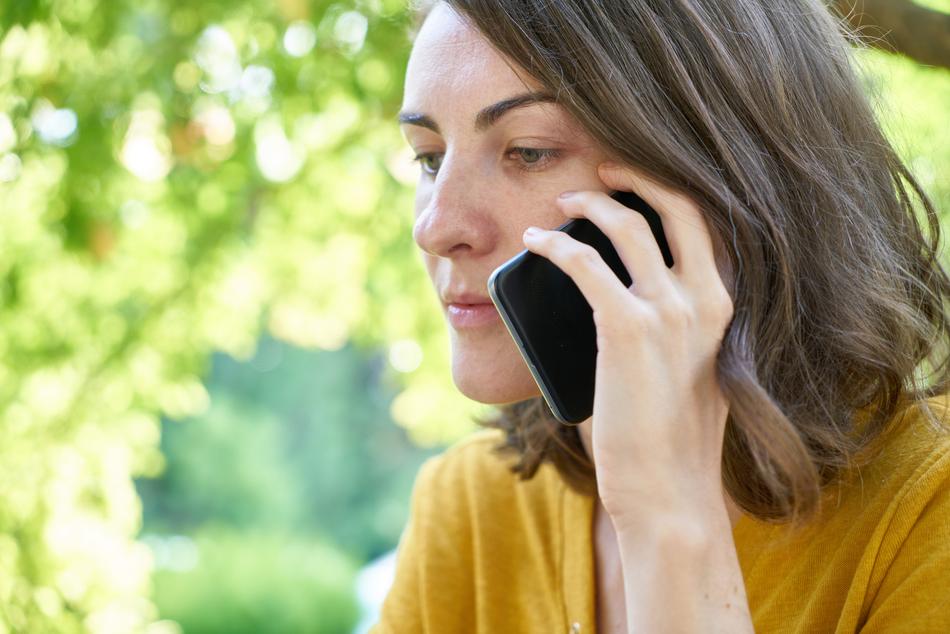 portrait of Woman with smartphone at ear