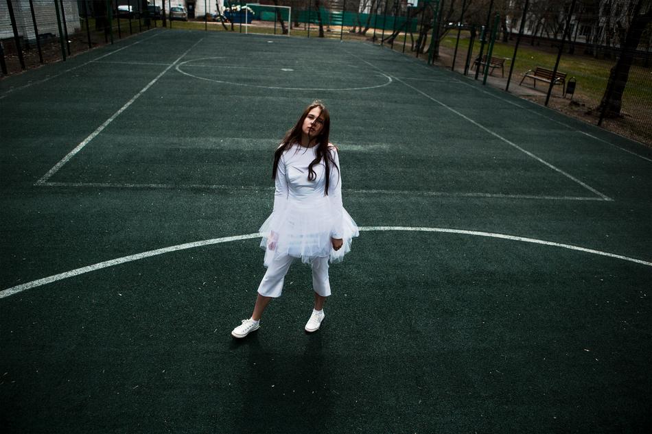 girl in a ballet tutu on a tennis court