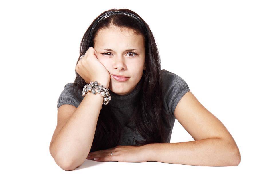 bored girl on a white background