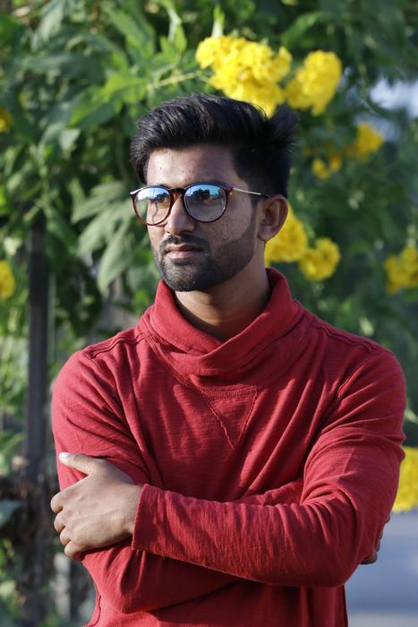 man in sunglasses posing on a sunny day