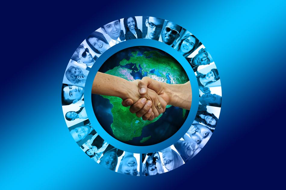 handshake on the background of the planet and pictures of people